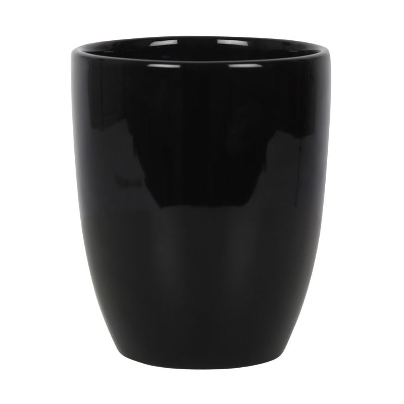 Ceramic plant pot with "Witch's Herb Garden" text and leaf design, ideal for growing magical herbs indoors.