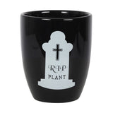 Gothic ceramic plant pot with tombstone shape and 'RIP plant' text, perfect for quirky home decor and plant lovers.