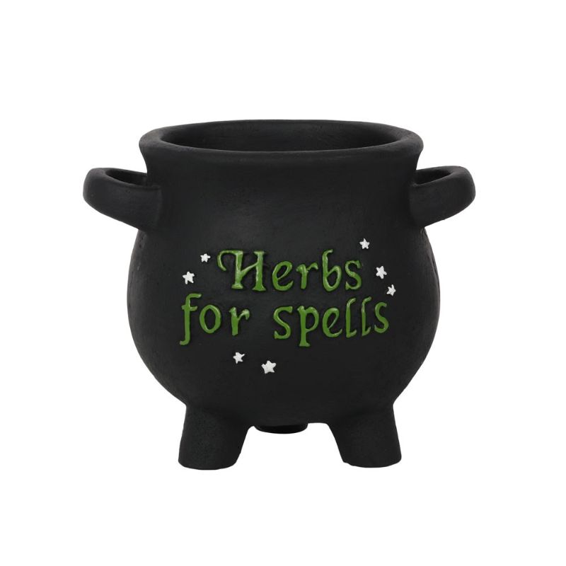 Small cauldron-shaped plant pot with 'Herbs for spells' text and star accents, ideal for growing herbs and witchy decor.