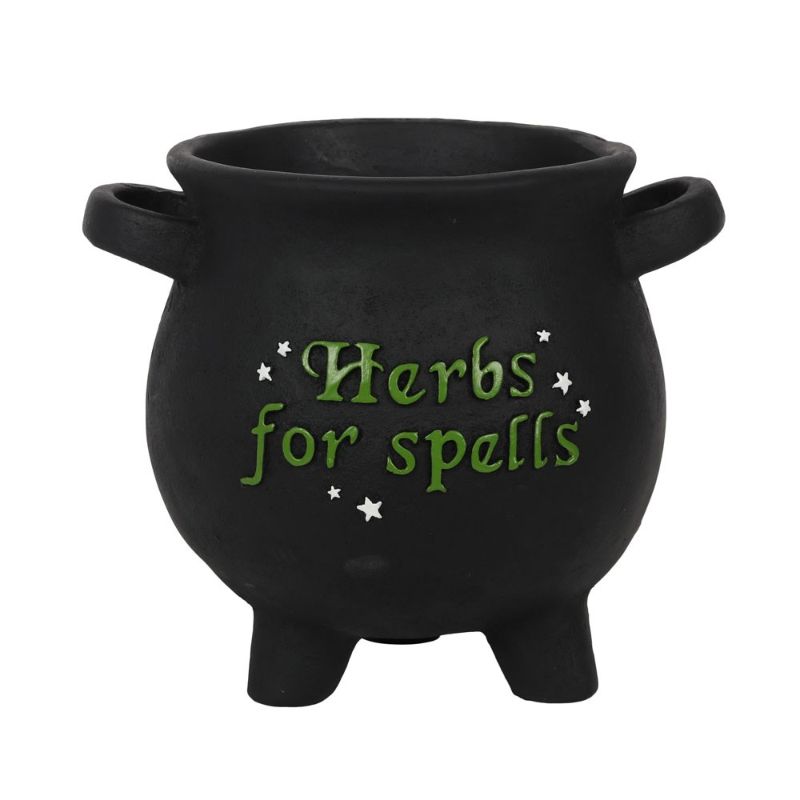 Large cauldron-shaped plant pot with 'Herbs for spells' text and stars, perfect for green witches and magical gardens.