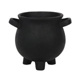 Large resin cauldron-shaped plant pot with 'Herbs for spells' text and star accents, perfect for green witches' gardens.