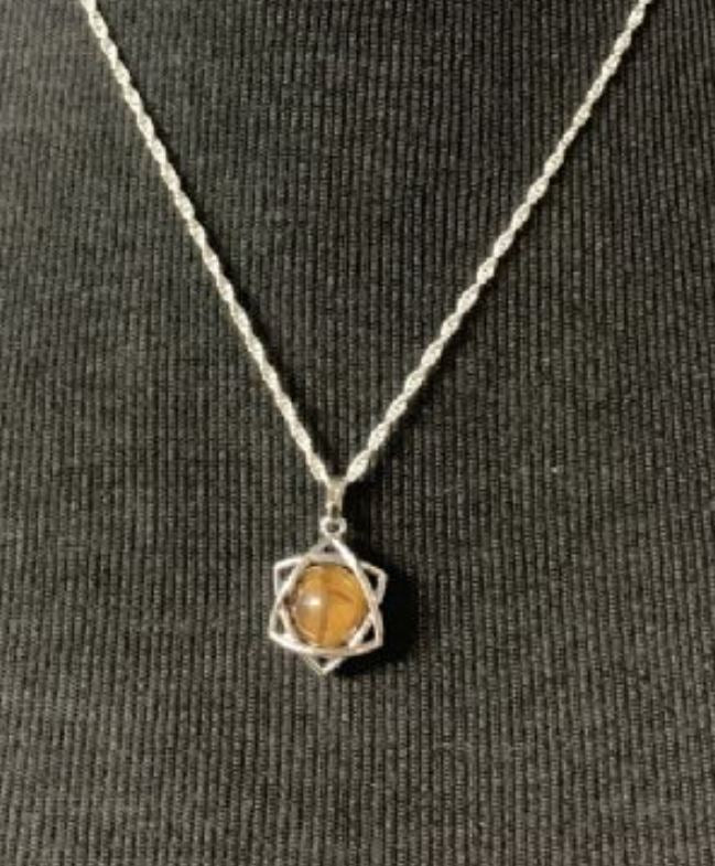 Tigers Eye Star Grounding Pendant featuring a star-shaped gemstone for emotional balance and grounding energy.