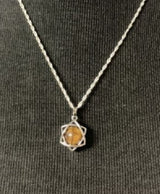 Tigers Eye Star Grounding Pendant featuring a star-shaped gemstone for emotional balance and grounding energy.