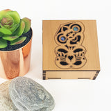 Square Trinket Box - Tiki (Small) with paua inlaid design, crafted from NZ veneer, perfect for storing jewelry and keepsakes.