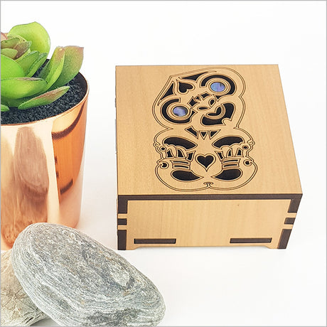 Square trinket box with paua inlays, crafted from NZ veneer, ideal for storing jewelry and keepsakes.