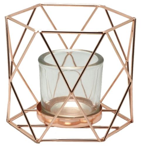 Stylish spherical tealight holder in copper with glass insert, perfect for adding warmth to any space.