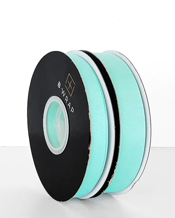 Aqua grosgrain ribbon, 22mm wide and 30m long, ideal for crafting, gift wrapping, and DIY projects with a vibrant color.
