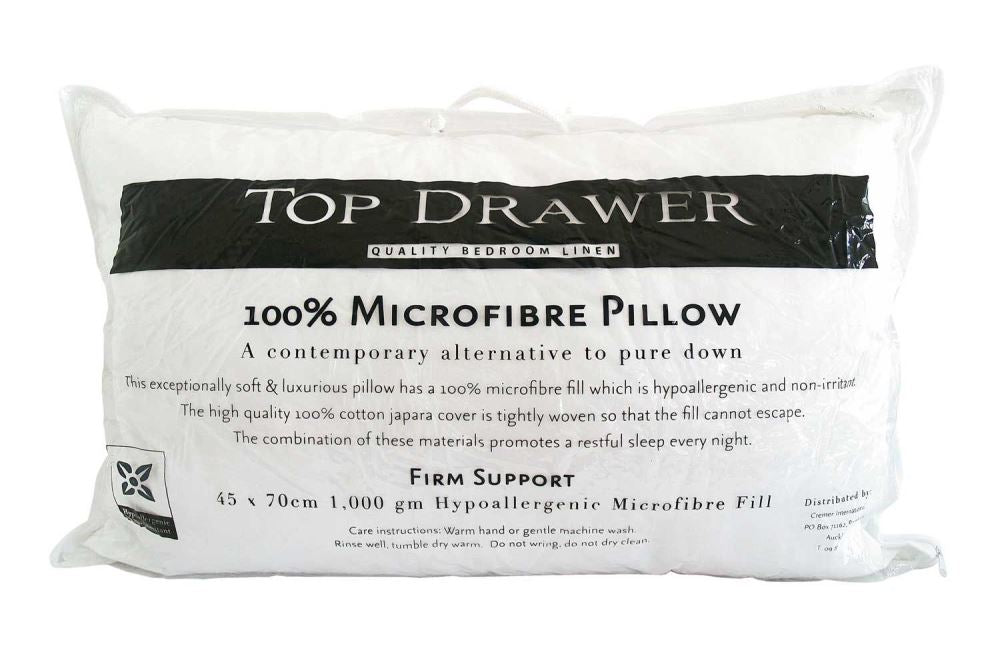 Firm microfibre pillow with 100% cotton cover, offering hypoallergenic support for a restful night's sleep.