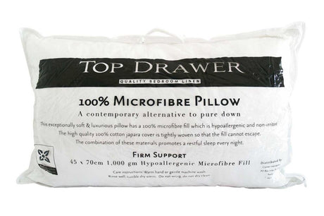 Firm microfibre pillow with 100% cotton cover, offering hypoallergenic support for a restful night's sleep.