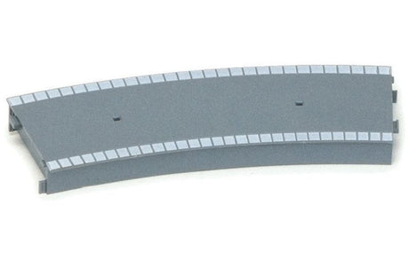 Curved plastic platform for model trains, fits second-radius track, enhances realism in railway layouts.