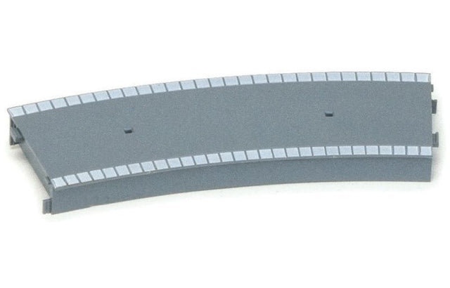 Curved plastic platform for model trains, fits second-radius track, enhances realism in railway layouts.