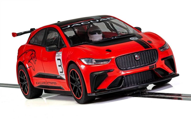 Red Scalextric Jaguar I Pace slot car, 1/32 scale, features digital plug capability and working lights for an authentic racing experience.