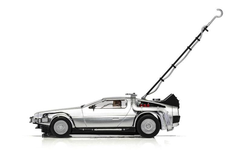 Detailed Scalextric DeLorean slot car from Back to the Future, featuring OUTATIME plate, lights, and removable lightning rod.