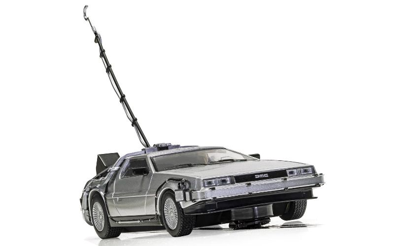 Slot car model of the DeLorean from Back to the Future, featuring iconic details, lights, and Magnatraction technology.