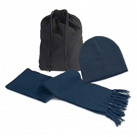 Navy scarf and beanie set made from soft knitted acrylic, featuring trendy tassels and packaged in a cotton drawstring bag.