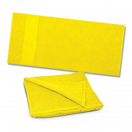 Vibrant yellow Dune Beach Towel made of soft, absorbent cotton for comfort and style at the beach or park.