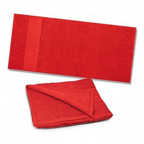 Vibrant red Dune Beach Towel made from soft 420gsm cotton, 700mm x 1400mm, perfect for sunbathing and outdoor relaxation.