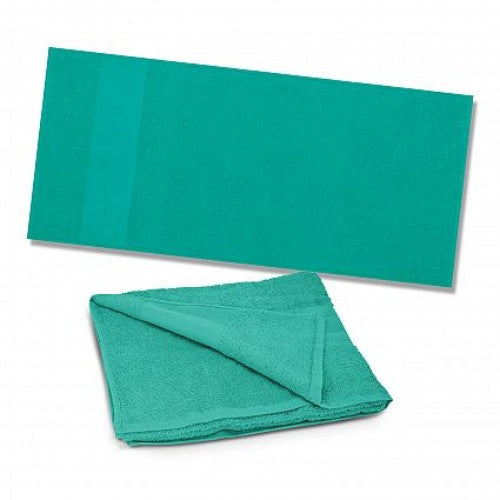 Vibrant teal Dune Beach Towel, 700mm x 1400mm, soft 420gsm cotton, ideal for summer fun at beach or poolside.