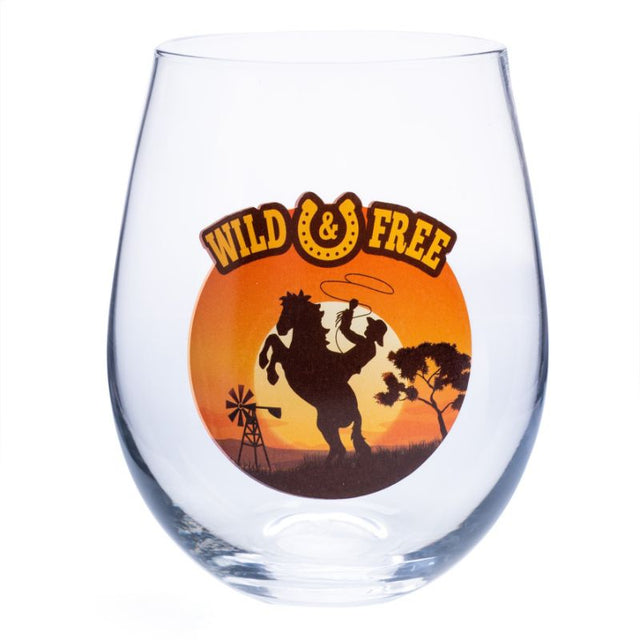 Stemless wine glass with cowboy silhouette and sunset, featuring "Wild & Free" lettering, perfect for rustic decor lovers.