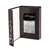 Set of 9 granite whisky stones in a velvet pouch, designed to chill drinks without dilution, ideal for connoisseurs.