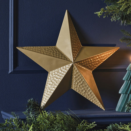 A 35 cm tall gold metal star decoration with a luxurious velvet finish, perfect for enhancing festive holiday decor.