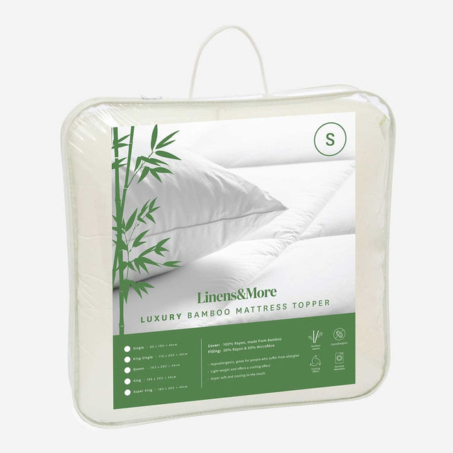 Bamboo Mattress Topper in white for single beds, hypoallergenic, soft, and temperature-regulating for improved sleep comfort.