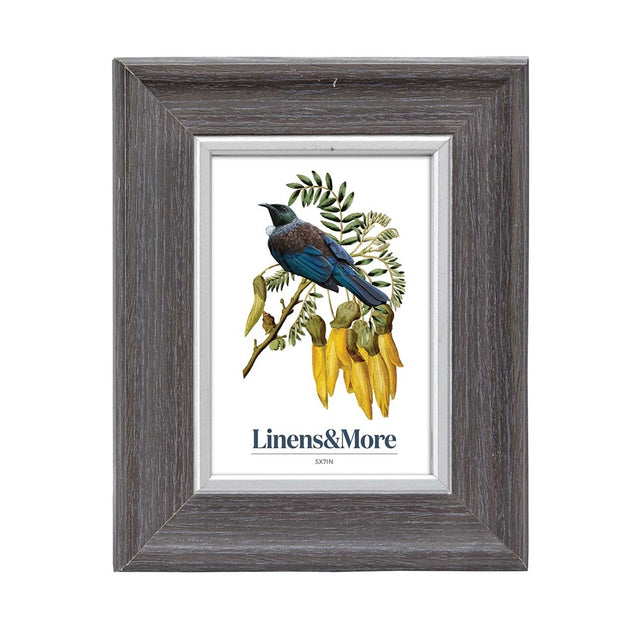 Silver edge photo frame for 5x7 inch photos, featuring a walnut finish and glass front, perfect for displaying memories.