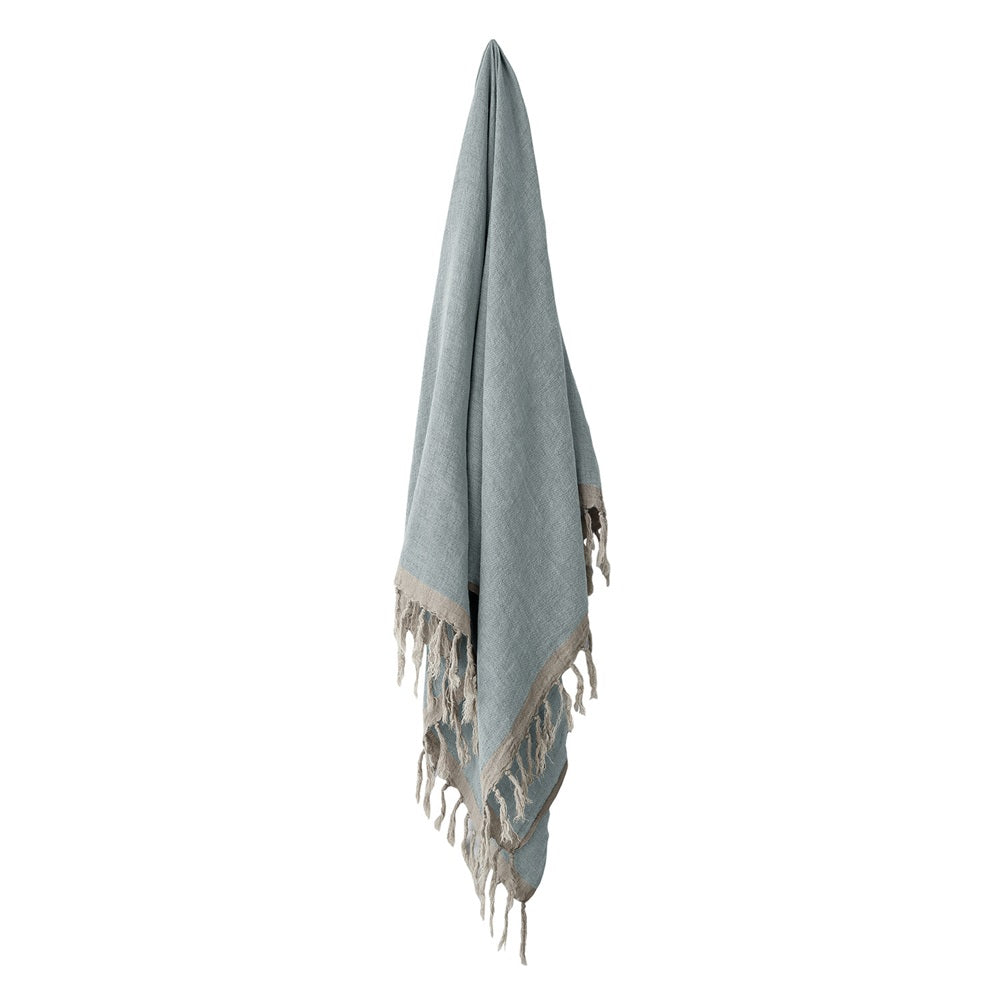 Hand woven chambray linen throw in cloud blue, 130x170cm, featuring elegant vintage wash and textured finish.