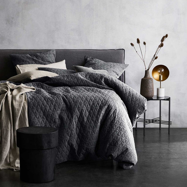 Luxurious greystone chambray quilted duvet cover, made of linen-cotton blend for a relaxed, vintage charm.