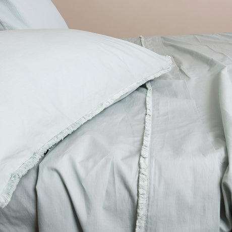 European pillowcase in sage with fringed edges, crafted from soft stone wash cotton for a stylish, vintage look.