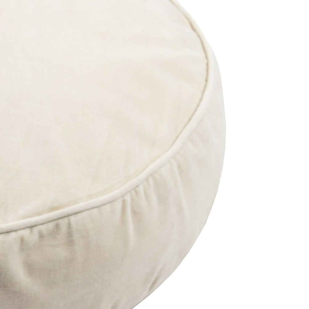 Elegant Bone White round cushion made of plush cotton velvet, featuring piping and a soft polyester filling for luxury and comfort.