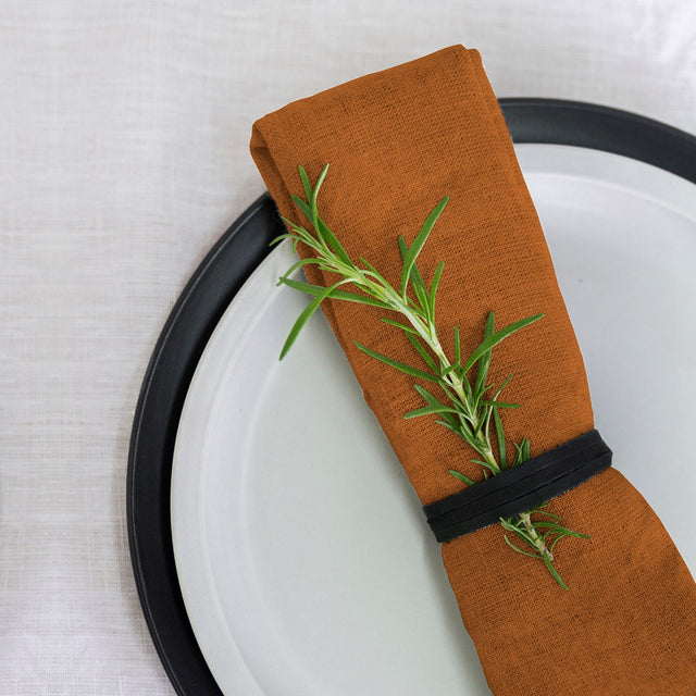 100% linen napkin set of 4 in rust color, 50x50cm, perfect for elegant dining and easy care. Eco-friendly craftsmanship from India.