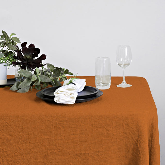 Elegant rust linen table runner, 40 x 150cm, perfect for enhancing any dining experience with sophistication.