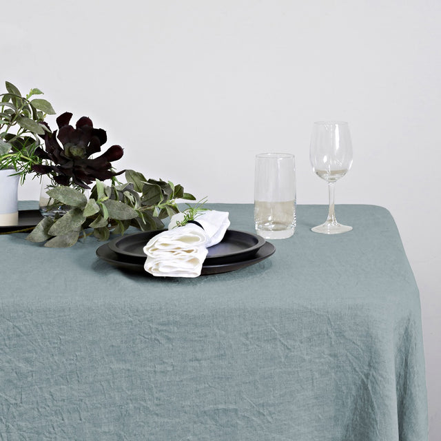 Elegant pearl blue linen table runner measuring 40 x 150cm, perfect for enhancing dining decor at any occasion.