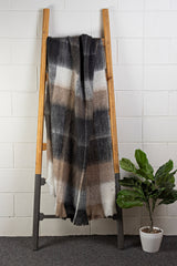 Luxurious beige and chocolate winter throw with eyelash fringe, crafted from mohair blend for cozy warmth and style.