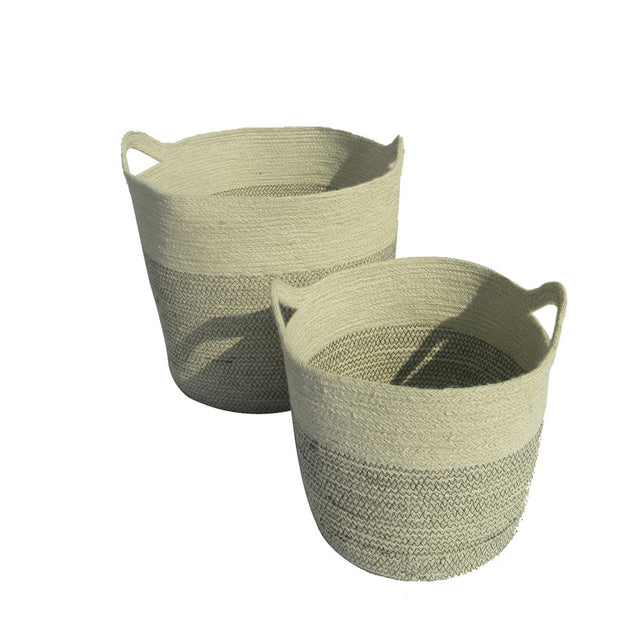 Set of two handcrafted jute round baskets in natural and white, featuring easy-grip handles and eco-friendly design.