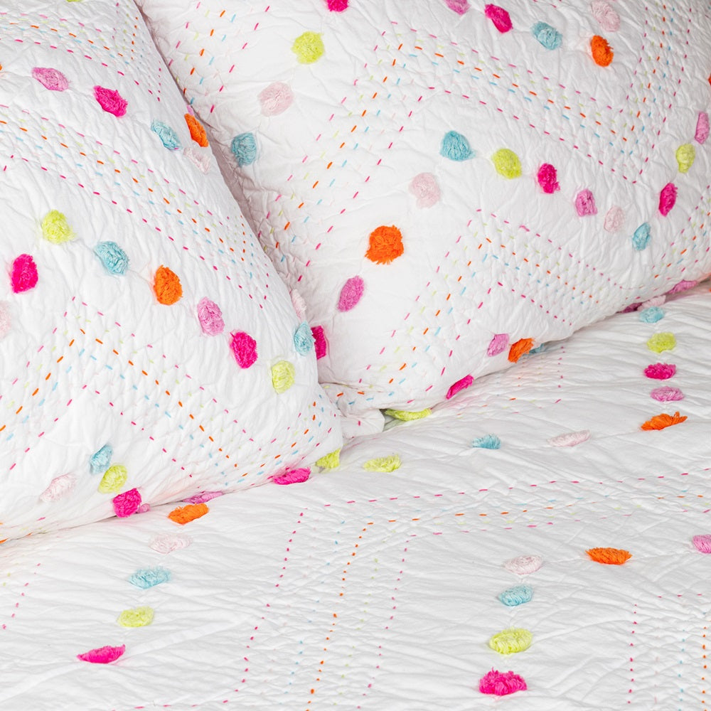 Hand-quilted Madelyn King Single Quilt in vibrant colors, featuring pom poms, 100% cotton, and perfect for kids' rooms.