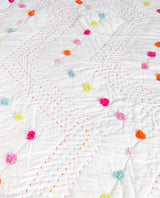 Hand quilted Madelyn King Single Quilt in vibrant colors with pom poms, perfect for young girls' rooms, 180 x 220 cm.