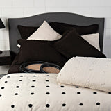 Astrid King Quilt in black with playful pom poms, crafted from a cotton/linen blend for cozy, stylish bedding.