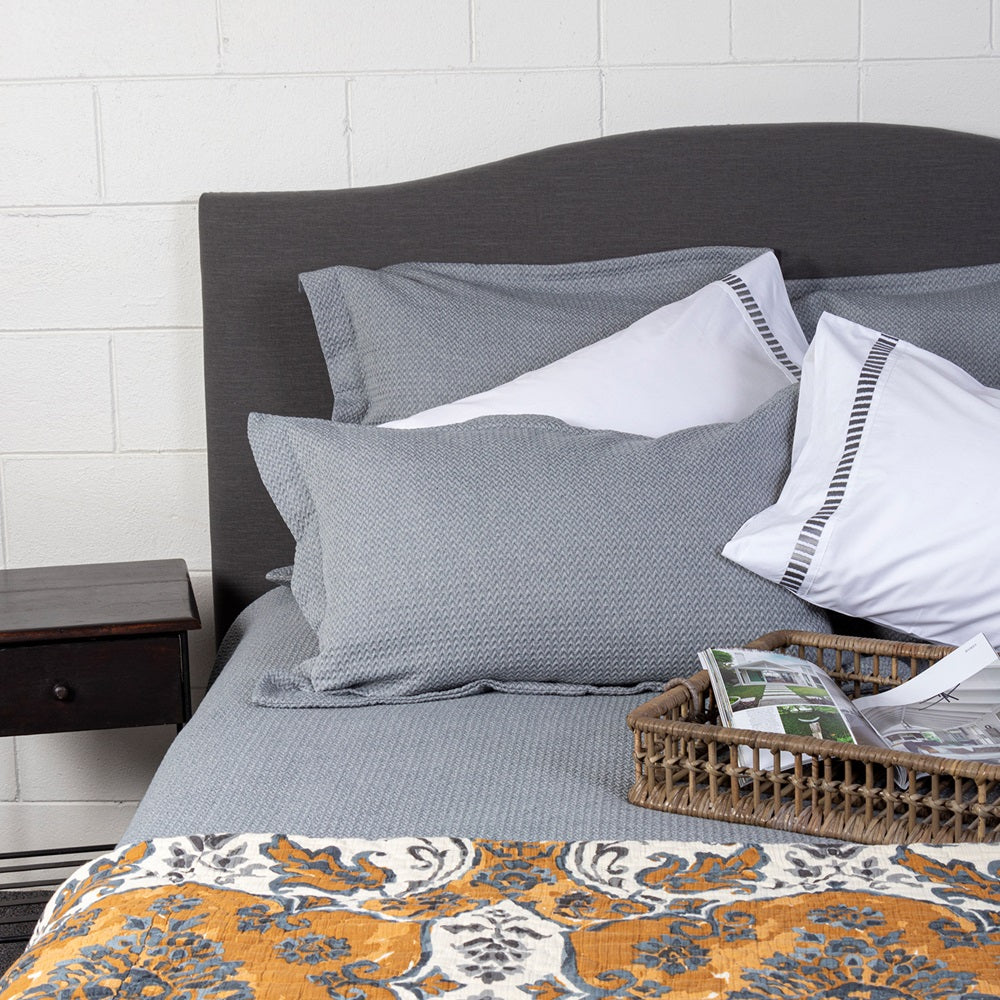 Sophia Queen Quilt in muted ochre and grey tones, 240 x 220 cm, featuring Moroccan tile-inspired design and plush cotton filling.