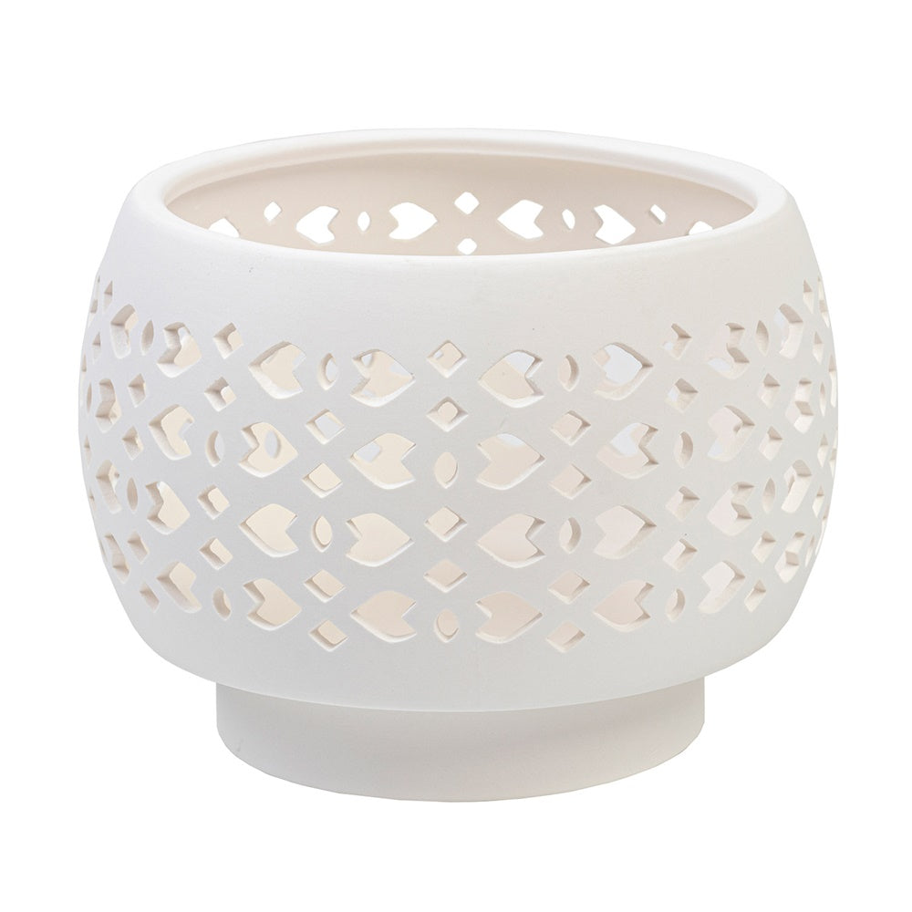 Sleek white planter pot with elegant cut-out design, ideal for displaying plants, candles, or trinkets in modern decor.