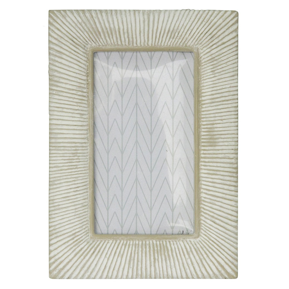 Off white resin photo frame for displaying cherished memories, measuring 20 x 14 cm.