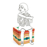 Colorful Djeco teepee toy box offers playful storage for toys and books, doubling as a sturdy child seat up to 30 kg.