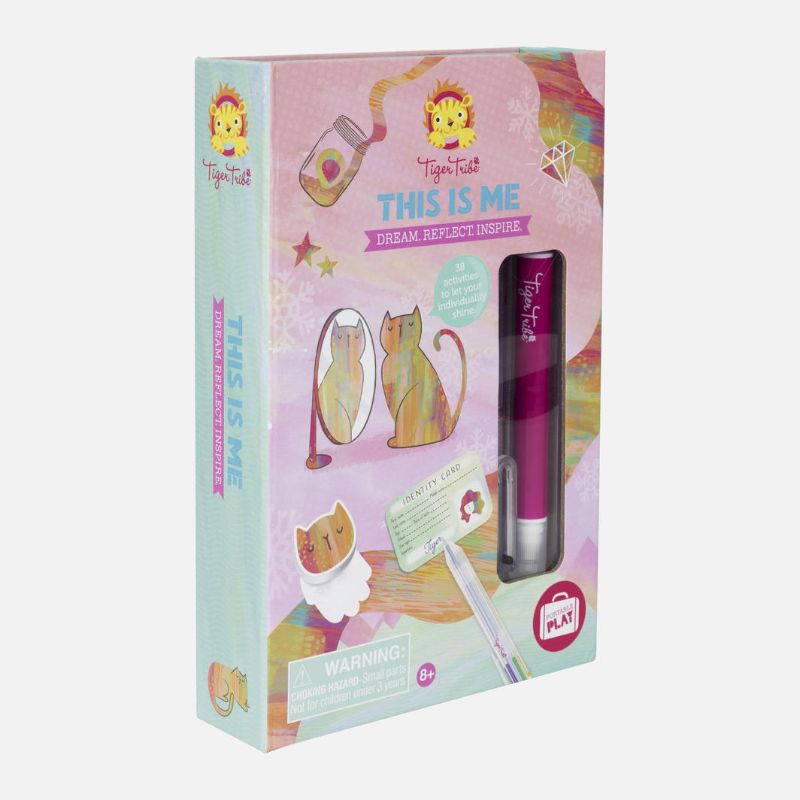 Child engaging with the This Is Me Kit by Tiger Tribe, fostering creativity and self-discovery with illustrated cards.