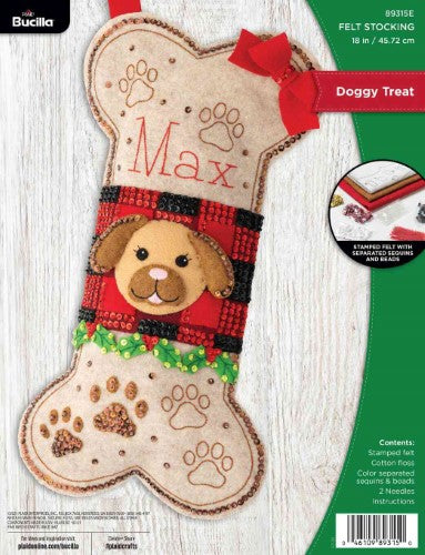 Applique stocking kit featuring an adorable dog's face, holly, and paw prints, perfect for festive pet-themed decor.