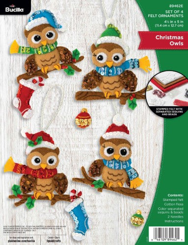 Whimsical Bucilla Christmas Owls felt ornament kit featuring four festive owls in Santa hats, perfect for holiday crafting.