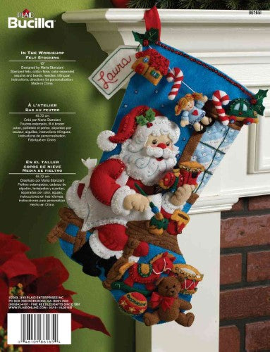 Bucilla 18" applique stocking kit featuring Santa and an elf in a toy workshop, perfect for festive holiday crafting.