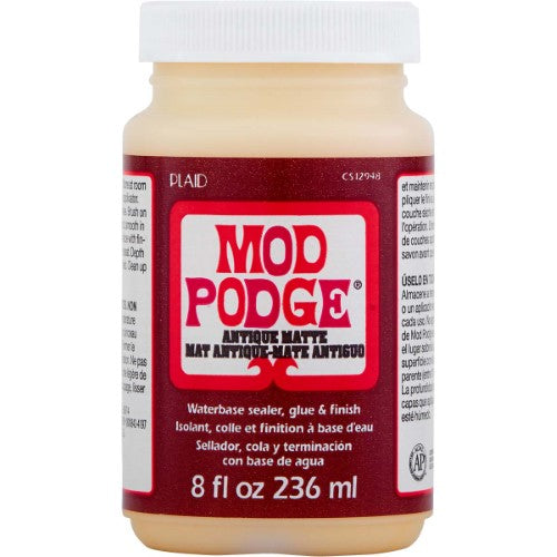 Mod Podge Antique Matte 8oz bottle, perfect for vintage decoupage and enhancing DIY projects with a rustic finish.