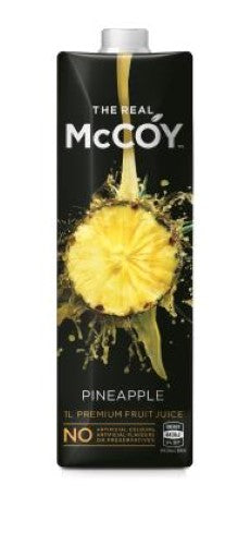 Bottle of McCoy Pineapple Juice, 1L, featuring pure tropical flavor without artificial additives, perfect for drinks and cocktails.