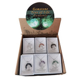 A display box with 12 Tree of Life pendants in 6 colorful designs, showcasing vibrant gemstones and elegant presentation.